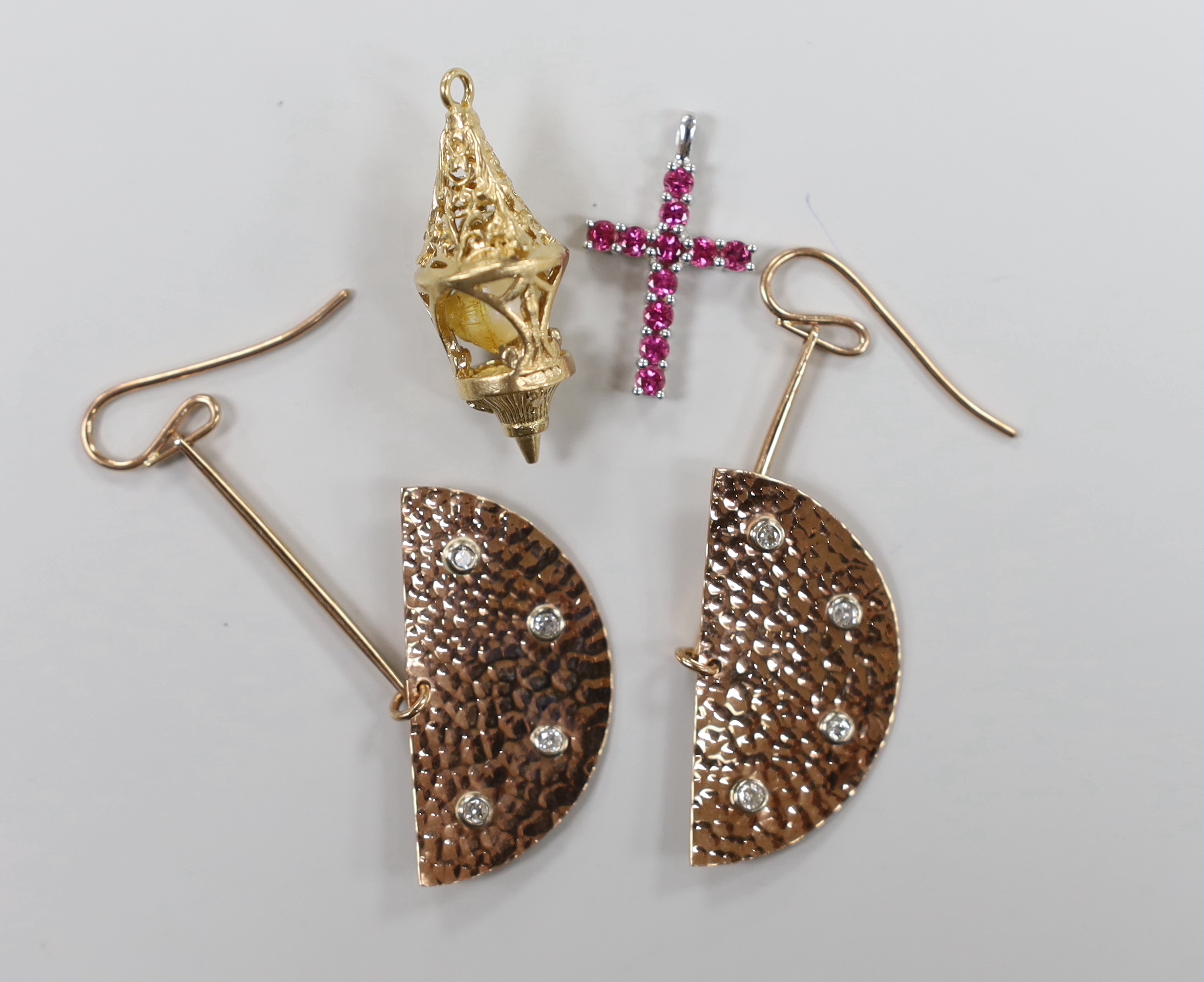 A pair of modern planished 9ct gold and four stone diamond chip set modernist earrings, 54mm, a 9ct white metal and gem set cross pendant and a 9ct gold and cultured pearl charm, gross weight 11.6 grams.